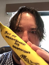 Size: 768x1024 | Tagged: safe, human, trotcon 2015, autograph, banana, buy my book, crazy eyes, crossing the memes, friendship is magic bitch, irl, irl human, larson you magnificent bastard, m.a. larson, meme, memeception, photo