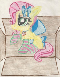 Size: 1670x2141 | Tagged: safe, artist:krazykari, fluttershy, g4, box, clothes, female, filly, flutterbox, socks, solo, striped socks, traditional art, younger