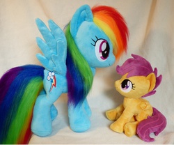 Size: 4152x3456 | Tagged: dead source, safe, artist:epicrainbowcrafts, rainbow dash, scootaloo, pegasus, pony, g4, blank flank, cute, duo, female, filly, foal, folded wings, irl, looking at each other, looking at someone, looking up, mare, photo, plushie, rainbow dash plushie, scootaloo plushie, scootalove, sitting, smiling, spread wings, wings