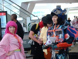 Size: 1024x768 | Tagged: safe, pinkie pie, human, bronycon, bronycon 2015, g4, 2015, clothes, cosplay, irl, irl human, optimus prime, photo, transformers