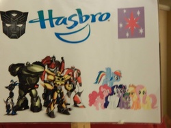 Size: 960x720 | Tagged: safe, applejack, fluttershy, pinkie pie, rainbow dash, rarity, spike, twilight sparkle, alicorn, pony, bronycon, bronycon 2015, g4, arcee, bulkhead, bumblebee (transformers), female, hasbro, mane seven, mane six, mare, optimus prime, photo, ratchet, sign, transformers, transformers prime, twilight sparkle (alicorn)