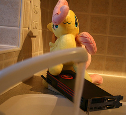 Size: 709x644 | Tagged: safe, artist:roborg, fluttershy, g4, amd, bootleg, graphics card, irl, photo, plushie, radeon, sink, this will end in tears, toy