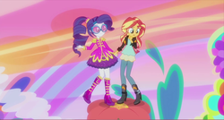 Size: 1363x731 | Tagged: safe, screencap, rarity, sunset shimmer, equestria girls, friendship through the ages, g4, alternate clothes, alternate hairstyle, flower, glasses, holding hands, mod, psychedelic, sgt. rarity