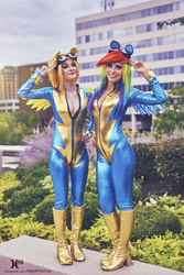 Size: 1365x2048 | Tagged: safe, artist:cosplayhazard, artist:xen photography, rainbow dash, spitfire, human, bronycon, bronycon 2015, g4, absolute cleavage, boots, breasts, cleavage, clothes, convention, cosplay, costume, duo, fake ears, fake wings, female, goggles, high heel boots, irl, irl human, photo, shoes, uniform, wonderbolts uniform