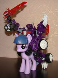 Size: 1500x2009 | Tagged: safe, twilight sparkle, g4, action pose, beast hunters, funko, irl, photo, riding, shockwave, sword, toy, toy pony cavalry, transformers, transformers prime