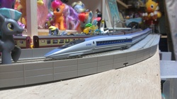 Size: 1280x722 | Tagged: safe, berry punch, berryshine, derpy hooves, fluttershy, rainbow dash, scootaloo, spike, thunderlane, chocobo, pegasus, pony, g4, brushable, bullet train, female, irl, mare, model train, photo, railroad, shinkansen, toy, train