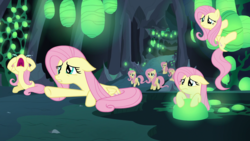 Size: 1920x1080 | Tagged: safe, screencap, fluttershy, changeling, pegasus, pony, g4, to where and back again, changeling hive, crying, crying flutterlings, cute, dilated pupils, disguise, disguised changeling, fake fluttershy, floppy ears, frown, nose in the air, open mouth, prone, sad, sitting, volumetric mouth