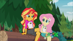 Size: 1366x768 | Tagged: safe, screencap, fluttershy, sunset shimmer, equestria girls, g4, my little pony equestria girls: legend of everfree, discovery kids, female, legs, lidded eyes, looking at each other, not what it looks like, out of context, sultry pose