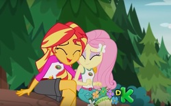 Size: 991x619 | Tagged: safe, screencap, fluttershy, sunset shimmer, equestria girls, g4, my little pony equestria girls: legend of everfree, cute, discovery kids, female, out of context, shimmerbetes, shyabetes