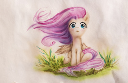 Size: 4588x2969 | Tagged: safe, artist:thevolshebniy, fluttershy, pegasus, pony, g4, female, grass, looking at you, mare, one wing out, outdoors, sitting, solo, traditional art, watercolor painting, windswept mane