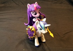 Size: 1600x1126 | Tagged: safe, shining armor, twilight sparkle, equestria girls, g4, clothes, doll, equestria girls minis, eqventures of the minis, guardians of harmony, humans riding ponies, misadventures of the guardians, riding, skirt, toy, twilight riding shining armor