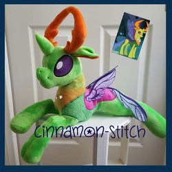 Size: 1000x1000 | Tagged: dead source, safe, artist:cinnamon-stitch, screencap, thorax, changedling, changeling, g4, to where and back again, changeling king, cropped, door, floppy ears, irl, king thorax, photo, plushie, prone, screencap reference, smiling, solo, spread wings