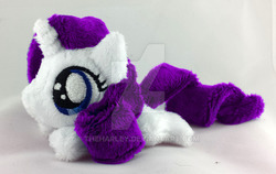 Size: 800x504 | Tagged: safe, artist:theharley, rarity, g4, beanie (plushie), female, filly, filly rarity, irl, mini, photo, plushie, prone, solo, watermark