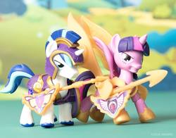 Size: 1080x847 | Tagged: safe, shining armor, twilight sparkle, alicorn, pony, g4, armor, frown, glare, gritted teeth, guardians of harmony, irl, misadventures of the guardians, photo, spread wings, toy, twilight sparkle (alicorn)