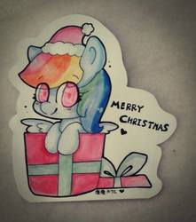 Size: 847x960 | Tagged: safe, artist:moonarty, rainbow dash, pony, g4, box, chibi, christmas, cute, dashabetes, happy, hat, irl, looking at you, photo, pony in a box, present, santa hat, solo, traditional art