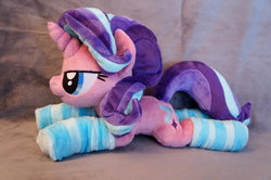 Size: 1024x680 | Tagged: safe, artist:fafatacle, starlight glimmer, pony, g4, clothes, irl, lidded eyes, photo, plushie, prone, socks, solo, striped socks