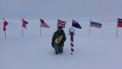 Size: 1024x577 | Tagged: safe, applejack, earth pony, human, pony, g4, antarctica, female, flag, irl, irl human, kneeling, mare, photo, plushie, south pole