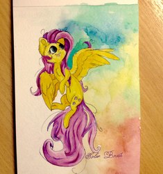 Size: 1360x1449 | Tagged: safe, artist:colorbrush, fluttershy, pegasus, pony, g4, cheek fluff, chest fluff, ear fluff, female, flying, looking away, looking up, mare, open mouth, smiling, solo, spread wings, traditional art, watercolor painting, wing fluff, wings