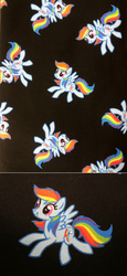 Size: 1280x2788 | Tagged: safe, part of a set, rainbow dash, g4, black background, fabric, irl, jo-ann's fabrics, merchandise, photo, simple background, smiling, solo