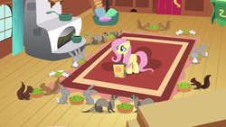 Size: 1280x720 | Tagged: safe, screencap, angel bunny, fluttershy, ferret, mouse, pegasus, pony, rabbit, rat, rodent, squirrel, g4, putting your hoof down, animal, bowl, celery, critters, eating, female, fluttershy's cottage, fluttershy's cottage (interior), herbivore, inaccurate, mare, rug, smiling, solo