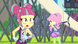 Size: 1280x720 | Tagged: safe, screencap, fluttershy, sour sweet, equestria girls, g4, my little pony equestria girls: friendship games, archery, arrow, bow (weapon), bow and arrow, female, weapon