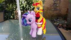 Size: 3264x1836 | Tagged: safe, artist:ketika, starlight glimmer, sunset shimmer, pony, unicorn, anthro, g4, anthro plushie, anthro with ponies, anthros riding ponies, aurora, clothes, female, irl, mare, photo, plushie, posable, riding, santa costume, socks, stockings, sunset santa, sunset shimmer riding starlight glimmer