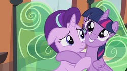 Size: 1280x720 | Tagged: safe, screencap, starlight glimmer, twilight sparkle, alicorn, pony, g4, the crystalling, female, grin, hape, hug, mare, out of context, twilight sparkle (alicorn)