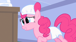 Size: 1280x720 | Tagged: safe, screencap, pinkie pie, earth pony, pony, baby cakes, g4, season 2, adult foal, changing table, derp, diaper, diaper on head, female, leaning, mare, multiple diapers, non-baby in diaper, raised hoof, solo