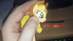 Size: 480x270 | Tagged: source needed, useless source url, safe, applejack, human, g4, 3d, animated, brony, creepy, figure, irl, irl human, pet, photo, pony stroking, that guy, toy, video at source
