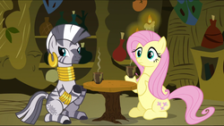 Size: 1360x768 | Tagged: safe, screencap, fluttershy, zecora, zebra, g4, magic duel, belly, cup, food, sitting, tea, zecora's hut