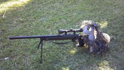Size: 960x540 | Tagged: artist needed, safe, derpy hooves, pegasus, pony, g4, female, ghillie suit, grass, gun, irl, mare, photo, plushie, rifle, weapon