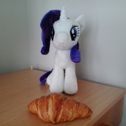 Size: 920x920 | Tagged: safe, rarity, g4, 4de, bread, croissant, desk, food, irl, photo, plushie, rarity looking at food, solo