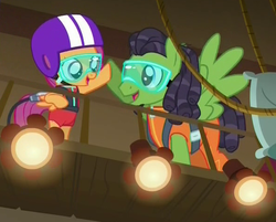 Size: 591x476 | Tagged: safe, screencap, geronimo, scootaloo, pegasus, pony, g4, on your marks, bungee jumping, clothes, dreadlocks, dreads, goggles, harness, helmet, hoofbump, jumpsuit, male, pillow, rope, spotlight, stage, stallion