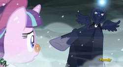 Size: 2521x1377 | Tagged: safe, screencap, princess luna, snowfall frost, spirit of hearth's warming yet to come, starlight glimmer, pony, unicorn, a hearth's warming tail, g4, cloak, clothes, discovery family logo, duo, female, frown, glare, glowing horn, hoof shoes, horn, light spell, low angle, magic, mare, pince-nez, pointing, snow, snowfall, spirit, spread wings