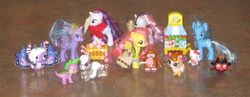Size: 2296x887 | Tagged: safe, artist:cheerbearsfan, fluttershy, princess luna, rarity, spike, sweetie belle, trixie, cat, dog, pony, skunk, unicorn, g4, bag, brushable, candy, cart, cupcake, female, food, hello kitty, irl, littlest pet shop, lollipop, madame pom, mare, moshi monsters, pepper clark, photo, sanrio, tiara, toy, wing hold