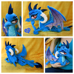 Size: 1600x1600 | Tagged: safe, artist:equinepalette, princess ember, dragon, g4, beanie (plushie), bedroom eyes, cute, dragoness, emberbetes, female, heart, irl, leaning, lying down, photo, plushie, prone, sassy, smiling, smug, solo focus
