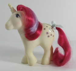 Size: 650x612 | Tagged: safe, photographer:breyer600, moondancer (g1), pony, unicorn, g1, bow, irl, photo, solo, tail bow, toy