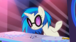 Size: 2349x1313 | Tagged: safe, screencap, dj pon-3, vinyl scratch, pony, unicorn, g4, the saddle row review, discovery family logo, female, mare, shrug, solo, sunglasses, turntable