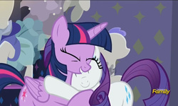 Size: 795x477 | Tagged: safe, screencap, rarity, twilight sparkle, alicorn, pony, g4, my little pony: friendship is magic, the saddle row review, discovery family logo, female, hug, mare, twilight sparkle (alicorn)