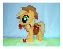 Size: 1903x1477 | Tagged: safe, artist:mlpplushies, applejack, earth pony, pony, g4, apple, food, irl, mouth hold, photo, plushie, saddle bag, solo