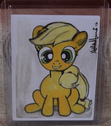 Size: 922x1050 | Tagged: artist needed, safe, applejack, g4, cute, female, filly, photo, sitting, solo, traditional art