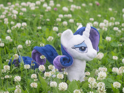 Size: 1000x750 | Tagged: safe, artist:valmiiki, rarity, g4, bedroom eyes, clover, dat face, doll, flower, garden, irl, nature, outdoors, photo, plushie, solo, toy