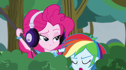 Size: 957x537 | Tagged: safe, edit, screencap, pinkie pie, rainbow dash, equestria girls, g4, my little pony equestria girls: friendship games, pinkie spy (short), bedroom eyes, bush, eyes closed, hand on shoulder, headphones, inverted mouth, open mouth, tree