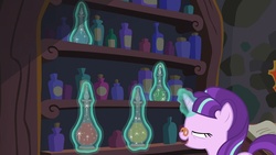 Size: 1920x1080 | Tagged: safe, screencap, snowfall frost, starlight glimmer, pony, unicorn, a hearth's warming tail, g4, bottle, female, glasses, magic, magic aura, mare, mid-blink screencap, pince-nez, solo, telekinesis