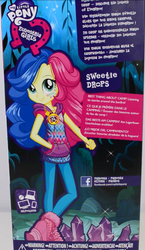 Size: 630x1086 | Tagged: safe, bon bon, sweetie drops, equestria girls, g4, my little pony equestria girls: legend of everfree, box art, camp fashion show outfit, clothes, doll, equestria girls logo, female, french, german, outfit, promotional art, solo, spanish, toy