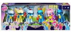 Size: 1523x696 | Tagged: safe, derpy hooves, fluttershy, pinkie pie, rainbow dash, soarin', spitfire, pegasus, pony, g4, cheerleader, clothes, female, mare, that one nameless background pony we all know and love, toy, wonderbolt trainee uniform, wonderbolts, wonderbolts uniform, wondershy