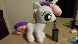 Size: 2688x1520 | Tagged: safe, artist:onlyfactory, sweetie belle, pony, unicorn, g4, bootleg, doll, electronic cigarette, exploitation, horn, irl, photo, plushie, toy, vape, vaping