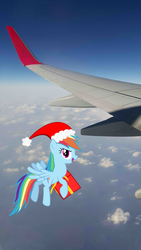 Size: 2988x5312 | Tagged: safe, artist:livehotsun, rainbow dash, g4, hat, irl, photo, plane, ponies in real life, present, santa hat, sky, solo, vector