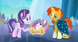 Size: 1665x893 | Tagged: safe, screencap, princess flurry heart, starlight glimmer, sunburst, alicorn, pony, unicorn, g4, the times they are a changeling, baby, baby bottle, baby pony, cradle, discovery family, discovery family logo, drinking, female, filly, foal, glowing, glowing horn, horn, logo, magic, male, mare, stallion, telekinesis, trio