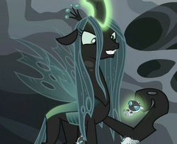 Size: 1319x1071 | Tagged: safe, screencap, queen chrysalis, changeling, changeling larva, changeling queen, g4, the times they are a changeling, female, glare, grin, grub, levitation, magic, smiling, smirk, telekinesis